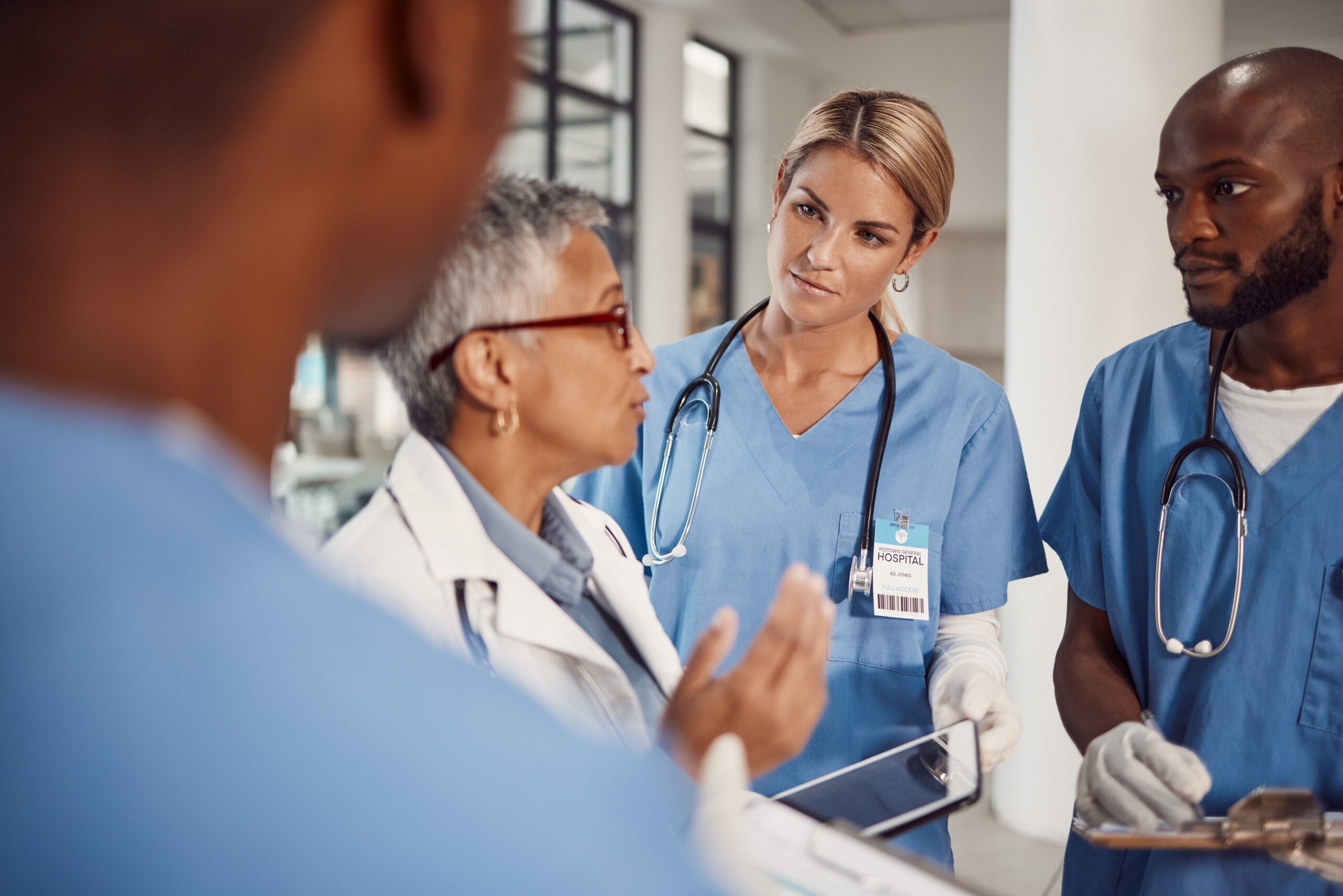 Several diverse doctors in a conversation
