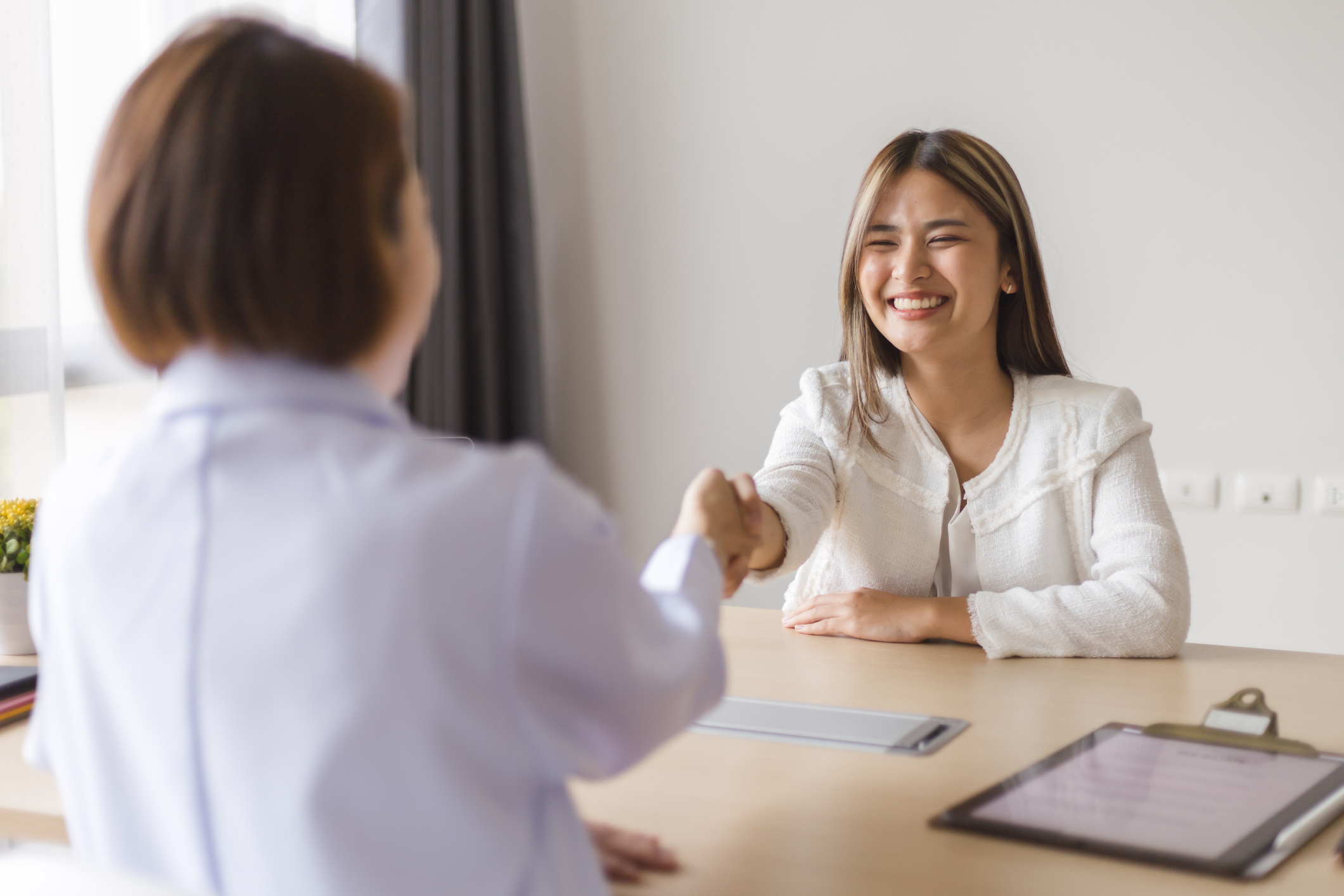 HR manager having a retention interview with a successful physician